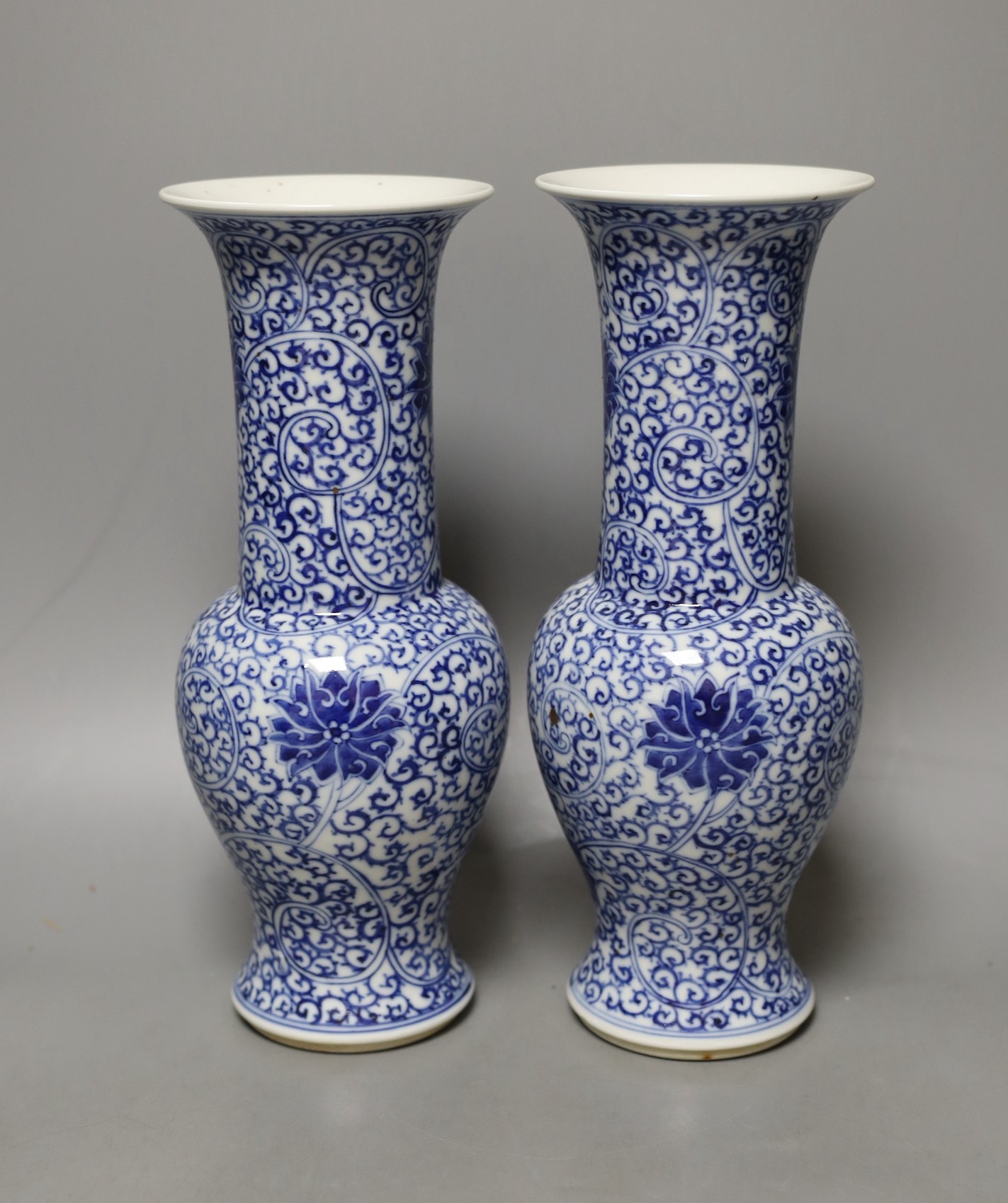 A pair of Chinese blue and white vases, 19th century, 28cm high.